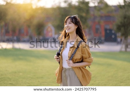Similar – Image, Stock Photo Beautiful Asian girl walking on the beach in Autumn during her trip