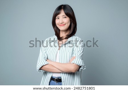 Similar – Image, Stock Photo Cheerful Asian woman looking at camera