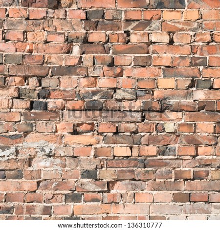 Outdoor photo of old ruined brick wall as abstract texture background