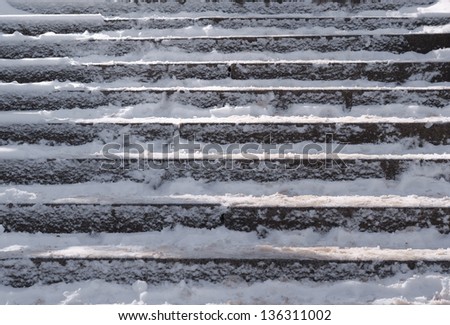Snow covered slippery stair case abstract winter background composition