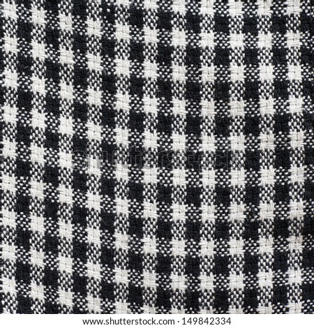 Squared black and white cloth material texture as a background