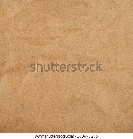 Slightly creased cheap brown packaging paper texture background