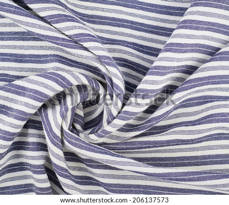 Fragment of a striped wrinkled white and blue cloth fabric as a background texture