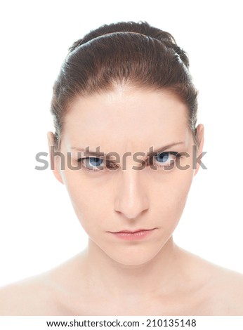 Young caucasian woman portrait with a concerned, serious and sullenly facial expression, isolated over the white background, natural make up and postprocessing