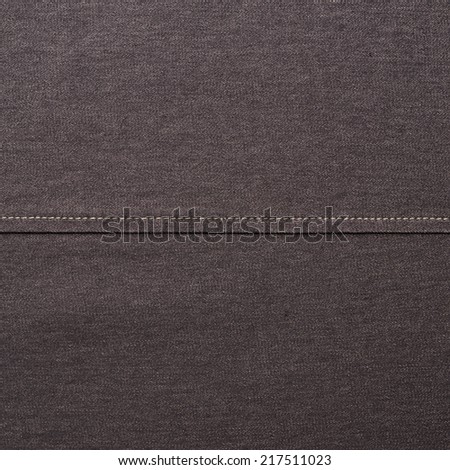 Black jeans cloth material fragment as a background texture composition