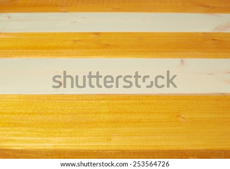 Colorful paint coated pine wood boards fragment as a background composition