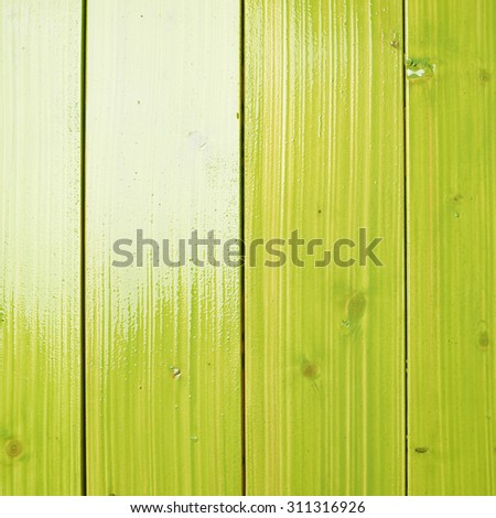 Recently painted in green wooden pine boards as a background texture composition
