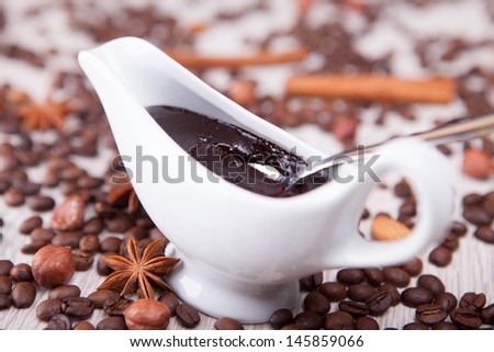 gravy boat with chocolate and coffee beans
