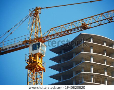 Crane. Self-erection crane over construction site. Crane near bulding. Industrial background. Stockfoto © 