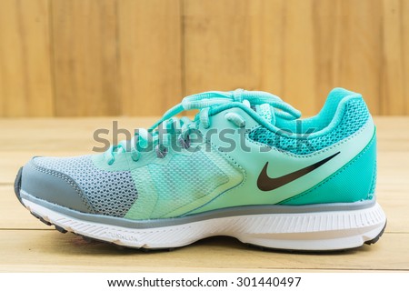 Tak, Thailand - JULY 30, 2015:NIKE-illustrative editorial,New unbranded running shoe, sneaker or trainer on brown background