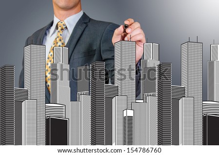business man drawing building