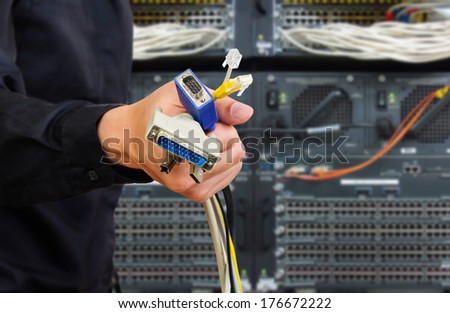 male holding several type of connector wire