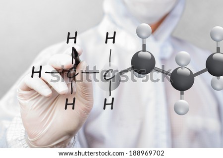 scientist in working suit drawing chemical structure