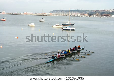 GETXO, SPAIN - FEBRUARY 16: A canoe training in the port of Getxo that it is celebrated in the month of February. February 16, 2013 in Getxo, Basque Country, Spain