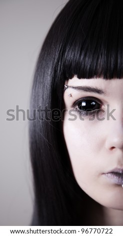 Spooky black eyed woman with pale skin, real sclera contact lenses