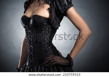 Close-up shot of an elegant woman in Victorian style corset, studio shot