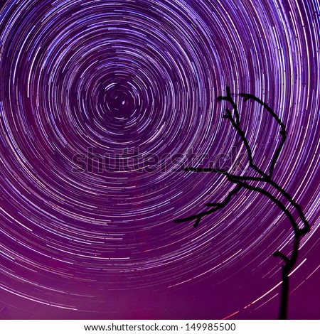 Deep magenta night sky sunset and star trails - unusual abstract background