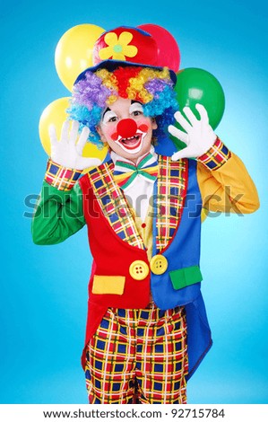Happy clown over the blue background