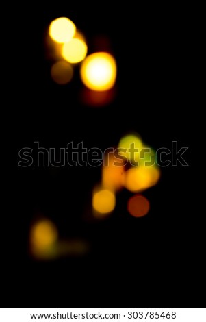 blurry,defocused bokeh lights in the dark abstract background/ texture/ backdrop