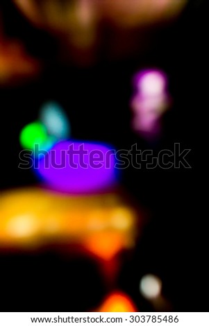 blurry,defocused bokeh lights in the dark abstract background/ texture/ backdrop