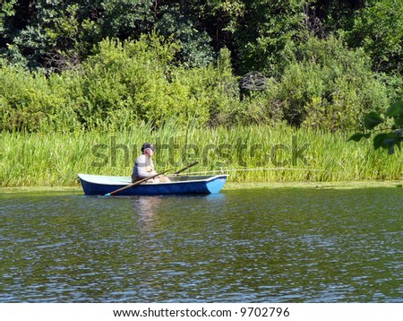 The lake. Fishing men on the boat