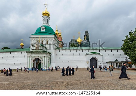 HOLY TRINITY St. SERGIUS LAVRA, RUSSIA - JULY 20: in spite of the construction works, a large number of tourists visit Lavra in action during the excursions event in Lavra on July 20, 2013.