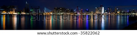 Stitched panorama of the city of Rotterdam and Mass River. Night scene