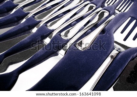 Close up of flatware on blue background