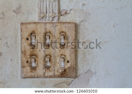 Old light switch on old wall