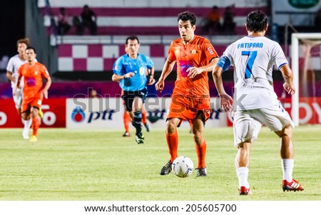 SISAKET THAILAND-JULY 13: Gorka Unda of Sisaket FC. (orange) in action during Thai Premier League between Sisaket FC and TOT S.C. at Sri Nakhon Lamduan Stadium on July 13,2014,Thailand