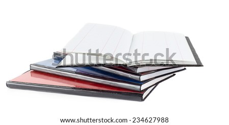 Heap of accounting notebook on white background  and  open noebook on op