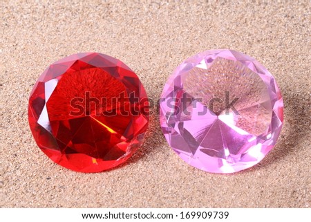 Red pink diamond on white surface
