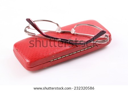 Eyeglasses on Red leather closed eyeglasses case isolated on white