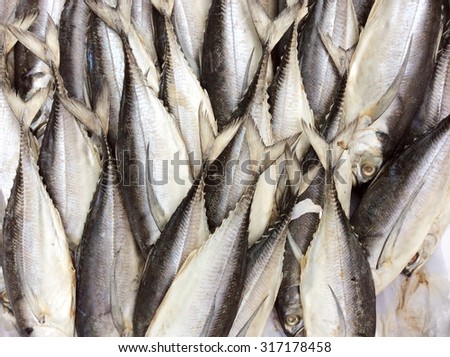 dry sardines on the basket ; fish background
