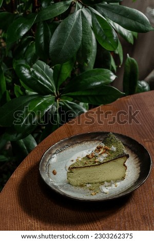 Similar – Image, Stock Photo Matcha cheesecake slice tart. Green cake slices equally