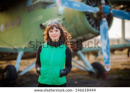 a love story. portrait of a young woman who dreams of traveling. exploring the world map. meeting at a retro airplane.