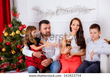 happy family home near the Christmas tree