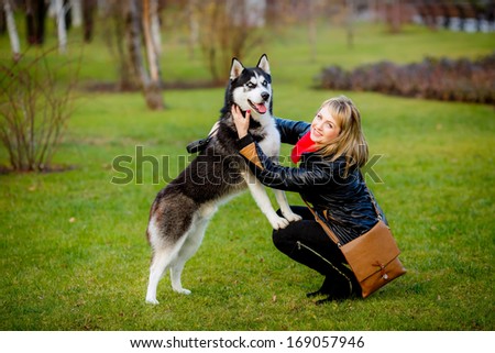 Friendship between human and dog - shaking hand and paw