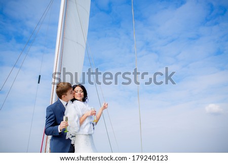 happy Bride and groom on yacht at wedding day. Luxury wedding. Happy newlyweds outdoors.