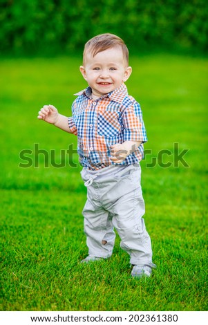 Adorable baby playing in the park.  smile, emotion, summer