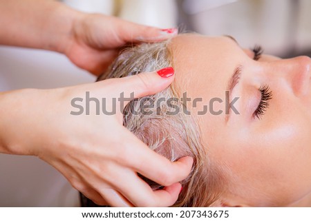 Hair beauty care, moisturizer application, hairdresser, hair mask of a beautiful girl, natural, health and beauty, closeup