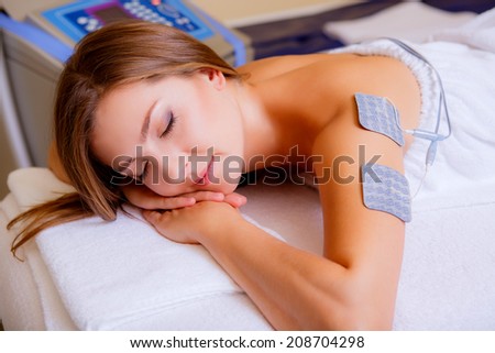 body treatments. beautiful girl receives cosmetic treatments in the beauty salon, health and beauty, body care, close-up