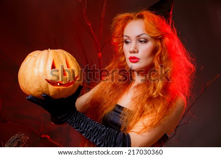 red-haired girl in a witch costume. masquerade. halloween, autumn
