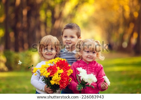 happy children in nature. boy gave flowers to a girl
