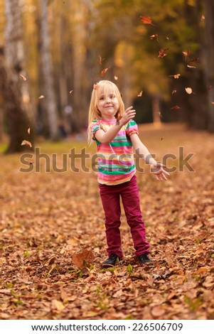 Beautiful girl jumping in autumn park. active, to rest, to run