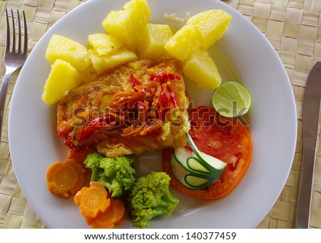 Grilled fish with veggies and potatoes: barracuda for lunch in Kuna Yala, Panama.