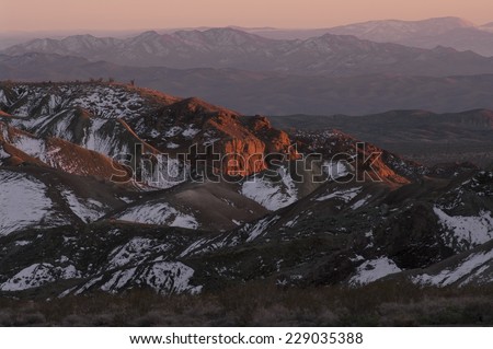 Southern California Mountains at sunset time. Southern view from the Rainbow Basin in the Calico Mountains, which are located in the Mojave Desert, San Bernardino County, California.