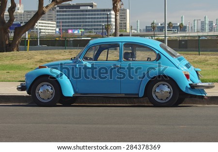 LOS ANGELES, CA, USA - JUNE 2 - a  Volkswagen Beetle parked near the Los Angeles World Airport. Shown on June 2, 2015 in Los Angeles, California, USA.