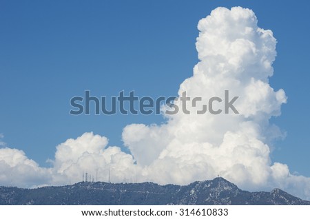 Rapidly evolving large clouds (cumulonimbus) over the San Gabriel Mountains on a very warm summer day. Photo taken on September 8, 2015 from Pasadena, California, USA.