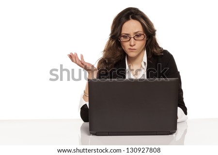 confused girl with a laptop and do not know what to do further